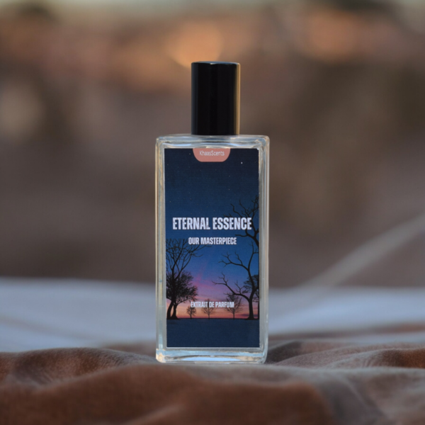 A Perfume named "Eternal Essence" is placed on the sand with the background of the desert